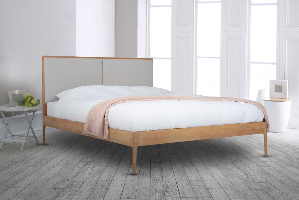 The Elegant Wooden Micah Wooden Bedframe joins Natural oak with an Upholstered headboard. With its minimalistic design creates a luxurious look with its fully upholstered headboard taking centre stage in any bedroom. Explore wide range of collection by Climate Mattress. 