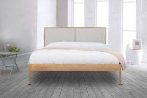 
                  
                    The Elegant Wooden Micah Wooden Bedframe joins Natural oak with an Upholstered headboard. With its minimalistic design creates a luxurious look with its fully upholstered headboard taking centre stage in any bedroom.
                  
                