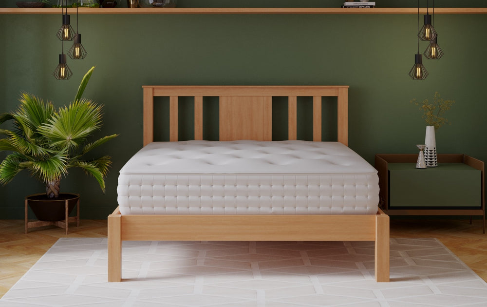 The Mia Wooden bedframe has a wooden slatted base and is constructed from solid rubber wood with finger joint lamination in an oak finish.